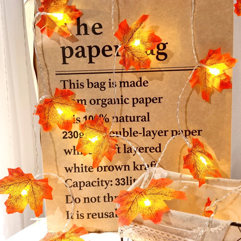 Halloween string lights with maple leaf decorations