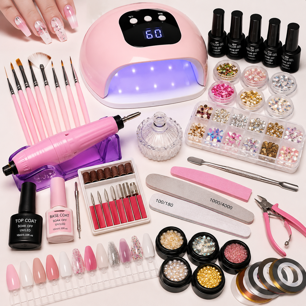 Nail art tools including UV lamp, nail drill, manicure brushes, nail polish, rhinestones and professional manicure accessories