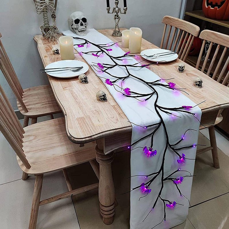 LED pumpkin Halloween lights on black willow branches