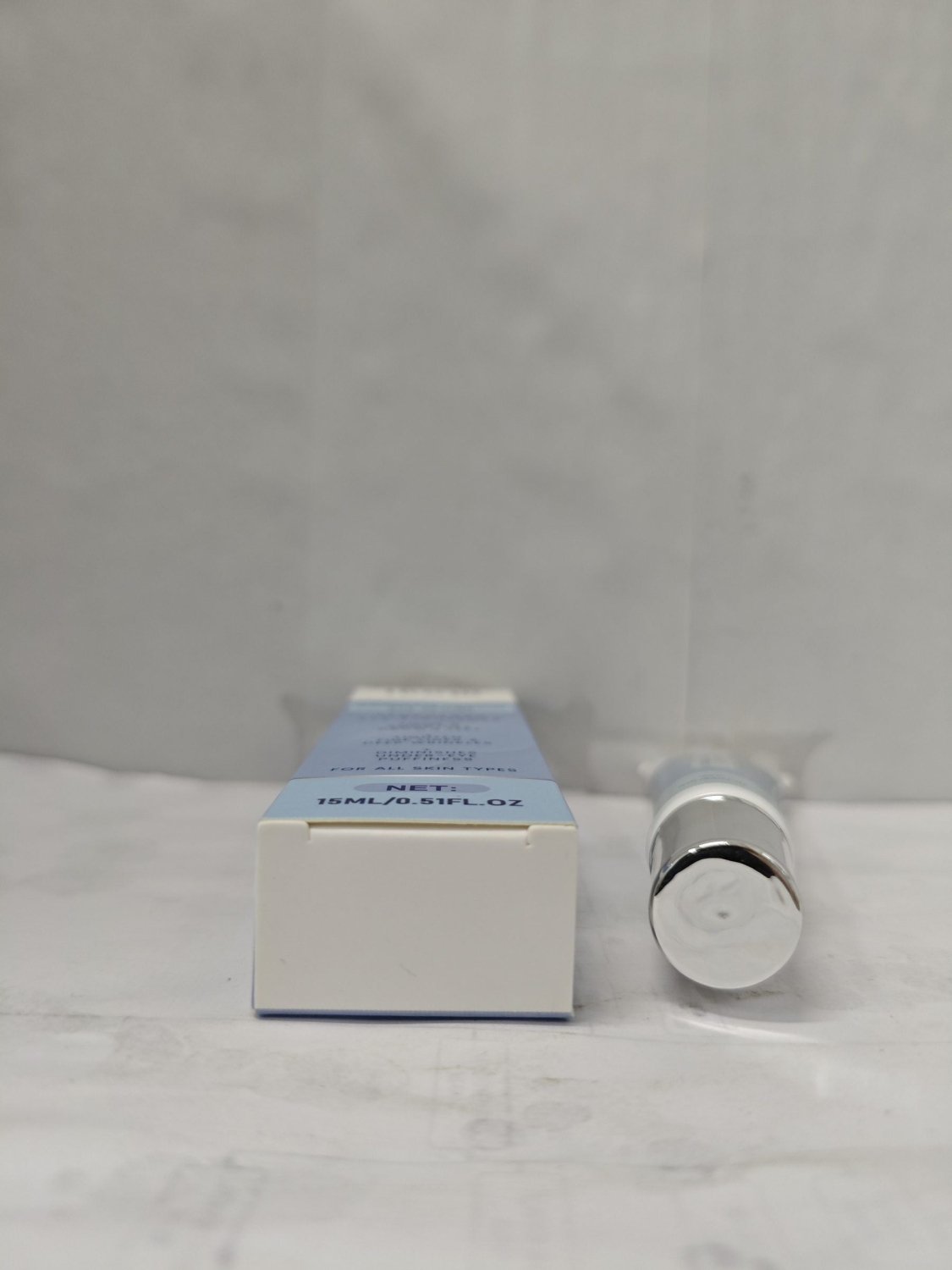 HOYGI temporary eye tightener 15ml cream tube and box viewed from above