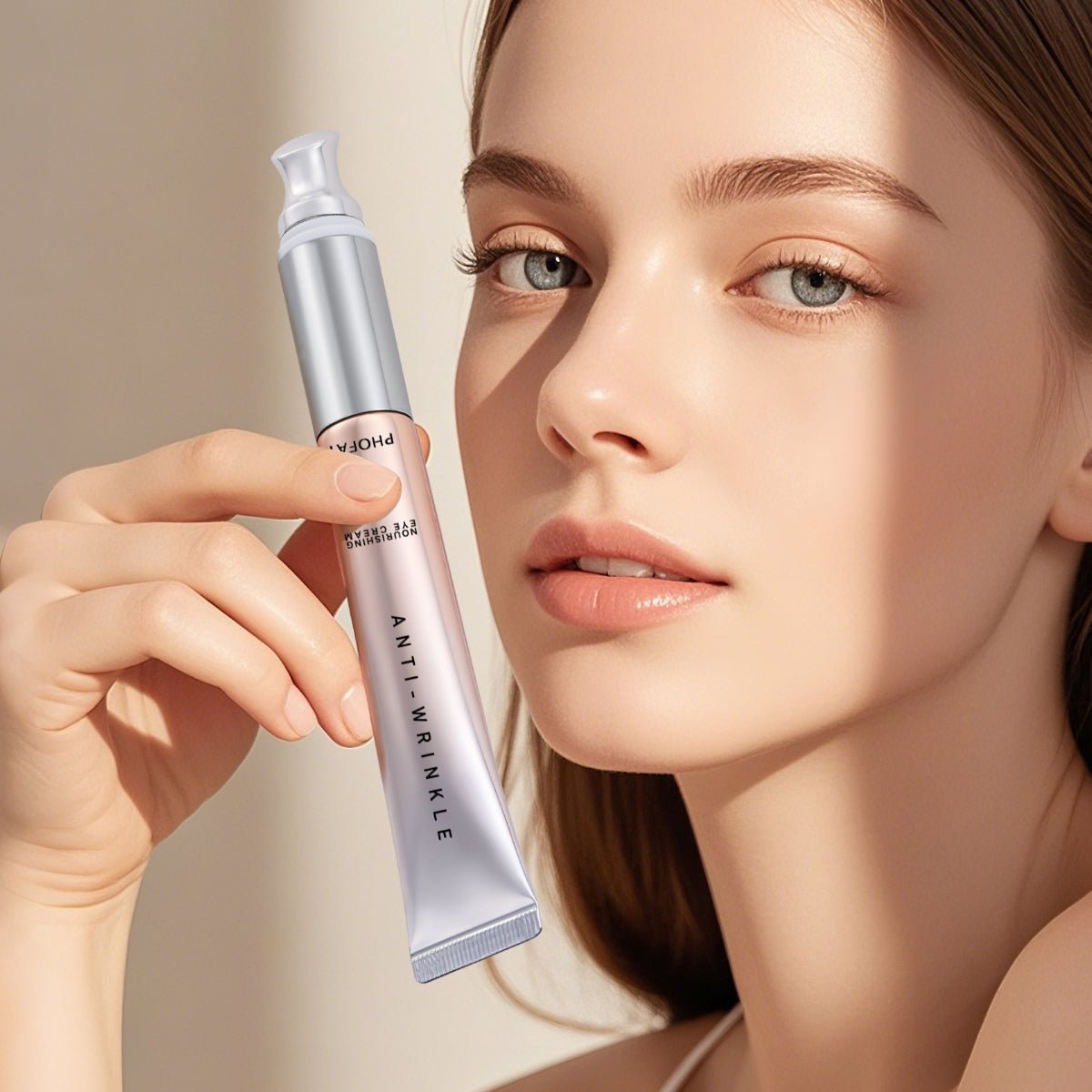 Woman holding a PHOFAY anti-wrinkle eye cream tube beside her face