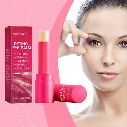 West Month retinol eye balm stick displayed beside a model demonstrating eye-area skincare
